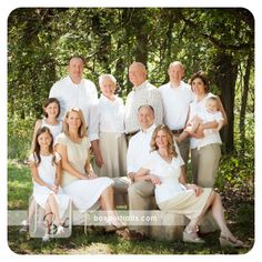 a large family poses for a photo in the woods with their two children and one adult