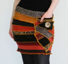 a woman is wearing a skirt made out of different colored fabrics and fabric materials