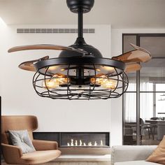 a living room with a ceiling fan and fire place