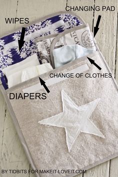 an opened diaper bag with instructions on how to fold the diaper in it