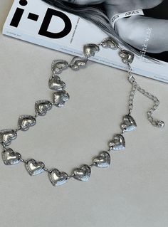 Waist belt  100% metal    Heart pendants  Silver-toned  Lobster clasp fastening  Length of S/M adjusts from: 60cm - 78cm / 23.6in - 30.7in    Length of X/XL adjusts from: 75cm - 96cm / 29.5in - 37.7in Adjustable Silver Belt Waist Chain, Silver Adjustable Chain Belt, Silver Metal Chain Belt, Silver Metal Waist Chain Belt, Vintage Silver Adjustable Chain Belt, Festival Belt, Festival Shop, Chain Belts, Festival Accessories