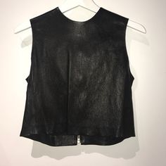 Real Leather. Never Been Worn! Black Structured Top For Formal Occasions, Black Leather Sleeveless Top, Designer Black Tops For Night Out, Luxury Black Tops For Workwear, Luxury Black Tops For Spring, Fitted Black Leather Tops, Chic Black Leather Top, Designer Black Sleeveless Top, Chic Leather Tops For Summer