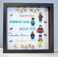 a shadow box frame with legos and scrabbles on it that says, you are smarter than stronger than brave than quicken than quicken than