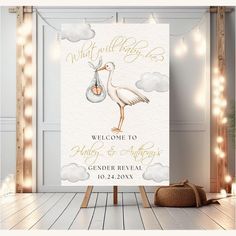 a welcome sign with a stork carrying a baby in a bag on it