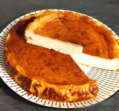 a cheesecake on a plate with one slice cut out and ready to be eaten