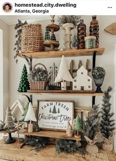 a shelf filled with christmas decorations on top of a wooden table