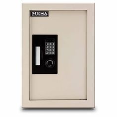 a white wall mounted safe with a keypad on the front and side panel open