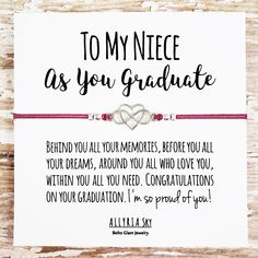 a card that says to my niece as you graduate with two intertwined hearts on it