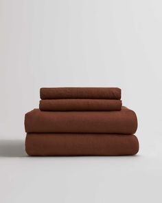 four brown sheets stacked on top of each other