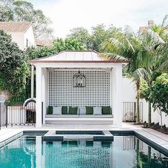 a pool with a gazebo next to it