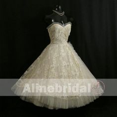 Dark Ivory Lace Sweetheart Strapless Vintage Homecoming Dresses This homecoming dress could be custom made, there are no extra cost to do custom size and color.Description of homecoming dress1, Material:lace, tulle 2, Color: picture color or other colors, there are 126 colors are available, please contact us for more colors, please ask for fabric swatch by this link: https://www.alinebridal.com/collections/extra-cost/products/fabric-swatch-fabric-sample, total cost is $20.003, Size: standard siz