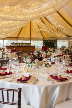 the tables are set with place settings for dinner