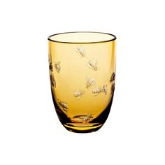 a yellow glass with bees on it