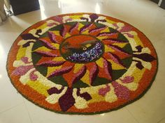 a colorful rug with a bird on it in the middle of a flooring area