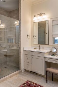 a bathroom with a walk in shower next to a sink