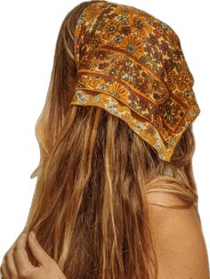 a woman with long hair wearing a bandana on top of it's head