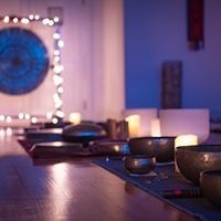 a room with candles and bowls on the table