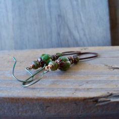 Love this deep green combined with the copper findings. These earrings are so rich in color! This listing is for these long, boho style, copper earrings. They are nearly 3 inches in total length. The smaller beads are 3x5mm deep green. The larger beads are 8mm, melon beads. These are absolutely stunning. For those that have sensitive ears and need a hypoallergenic option, this is the shop for that! All of my earrings can be made with hypoallergenic, pure titanium ear wire. This pair would includ Handmade Rustic Green Earrings, Rustic Handmade Green Earrings, Green Copper Earrings With Ear Wire, Green Copper Earrings, Handmade Copper Green Earrings, Handmade Green Copper Earrings, Earthy Green Dangle Earrings, Green Rustic Dangle Earrings, Rustic Green Dangle Earrings