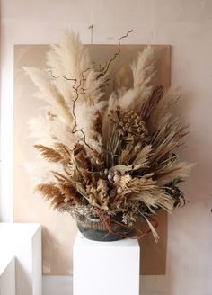 Soft fluffy pampas and sculptural palm leaves. This is a beautifully luxury vase arrangement. Large Dry Flower Arrangements, Twisted Hazel, Dried Floral Arrangements, Statement Vase, Luxury Vase, Flower Arrangement Designs, Florist Design, Pampas Grass Decor, Stone Vase