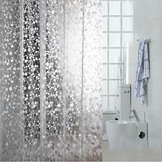 the shower curtain is white and has silver dots on it, along with an image of a