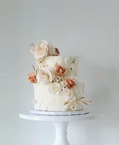 there is a white cake with flowers on it