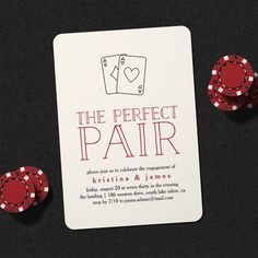 the perfect pair wedding card and poker chips on black background with red lettering, which reads'the perfect pair '