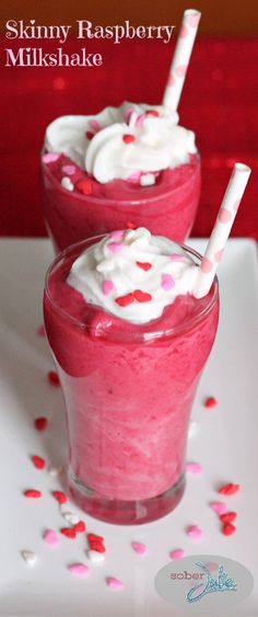 two glasses filled with pink and white liquid