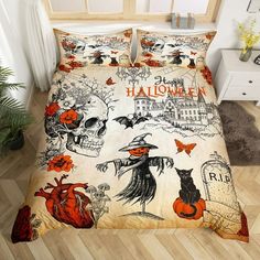 a bed with halloween themed sheets and pillows