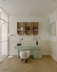 a white room with wooden floors and shelves on the wall, along with a green desk