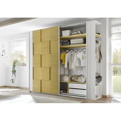 a white and yellow closet with clothes on shelves next to a potted plant in the corner