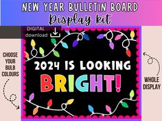 the new year bulletin board display kit is looking bright with lights and words on it