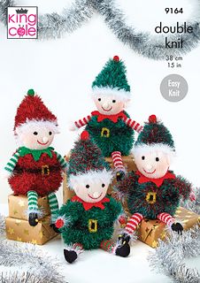 the knitted christmas elves are posed together