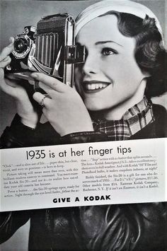 an advertisement for kodak's camera with a woman holding it