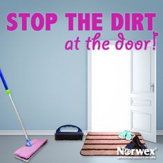 a pink mop sitting on top of a rug next to a doorway with the words stop the dirt at the door