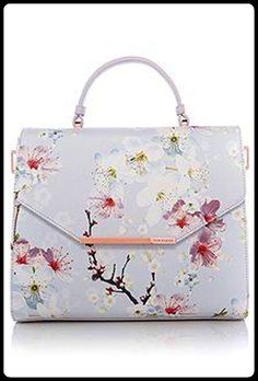 a white purse with pink flowers on it