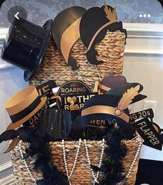 a basket filled with hats and decorations on top of a table