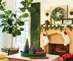 a living room filled with furniture and a fire place covered in christmas stockings next to a fireplace