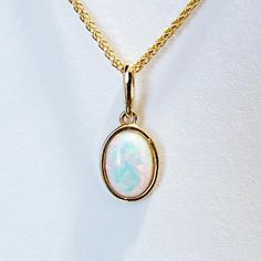 A kaleidoscope of colors explode from this beautiful, lab created opal pendant. Set in 14ky gold and approximately 1" long by 1/2" wide. *Chain not included Ruby Diamond Pendant, Lapis Pendant, Gemstone Pendants, Rose Quartz Pendant, Opal Pendants, Quartz Pendant, Emerald Diamond, Pendant Set, Pearl Pendant