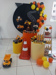 there is a construction themed birthday party on the floor