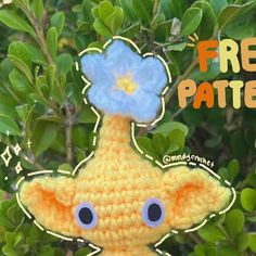 a crocheted stuffed animal with a flower on it's head and the words free pattern below