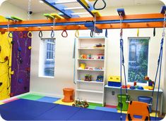 a child's play room with toys and climbing equipment