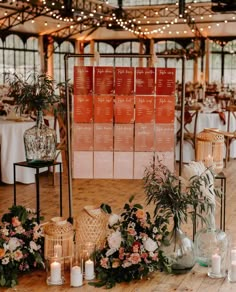 the tables are set up with flowers and candles