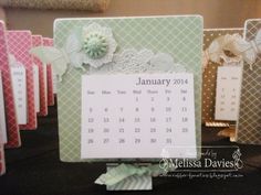 a table with calendars and place cards on it