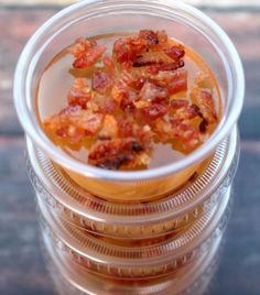 a glass filled with food sitting on top of a table