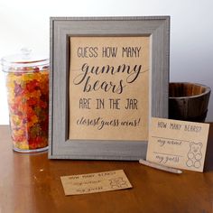 there is a sign that says guess how many gummy bears are in the jar