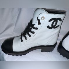 Nib; 100% Authentic; White And Black Leather; 39.5 Size; Pearl Accent; Silver Hardware; Black Laces; White Flat Heel Boots For Streetwear, Luxury White Sneakers With Rubber Heel Cap, Casual White Boots With Rubber Heel Cap, White Lace-up Boots With Leather Sole, White Calf Leather Boots With Round Toe, White Almond Toe Boots With Branded Insole, Sporty White Leather Boots, White Luxury Calf Leather Boots, Luxury White Calf Leather Boots