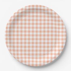 an orange and white checkered paper plate