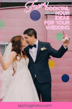 a bride and groom standing in front of a pink wall with confetti on it