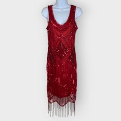 An Evening Wear Dress From Gatsbylady London: - Size 6 - Red Mesh Fabric With Sequin And Beading Design - Beaded Fringe On The Bottom Hem - Fully Lined - Pullover - Sleeveless - 100% Polyester Features/Style/Aesthetics: Sequins, Beading, Shiny, Sparkle, Evening Wear, Formal, Cocktail, Party, Art Deco, Flapper, 1920s, Costume Pictures Show Approximate Measurements. Please Ask Any Questions! Red Embellished Sequin Evening Dress, Red Sequin Holiday Evening Dress, Red Vintage Mini Dress For Party, Red Sequin Holiday Dress, Fitted Red Flapper Dress With Sequins, Red Fitted Flapper Dress For Parties, Fitted Red Sequin Flapper Dress, Elegant Red Sequined Flapper Dress, Elegant Red Flapper Dress With Sequins