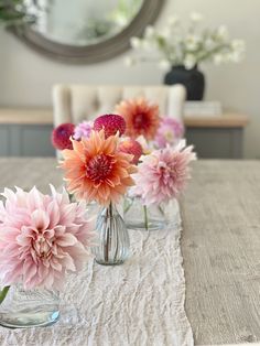 Dahlias in bud vase Dahlia Centerpiece Wedding Simple, Small Dahlia Arrangement, Dahlias In Bud Vases, Dahlia Table Decorations, Dahlia Bud Vases, Bud Vases Wedding Centerpiece Circle Table, Orange Bud Vases, Dahlia Bud Vase, Daisy Bud Vase